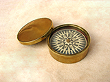 Early Victorian brass cased floating dial compass with domed lid.